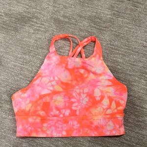 NWOT Lululemon size 10 sports bra. Peach, pink, yellow, and white.